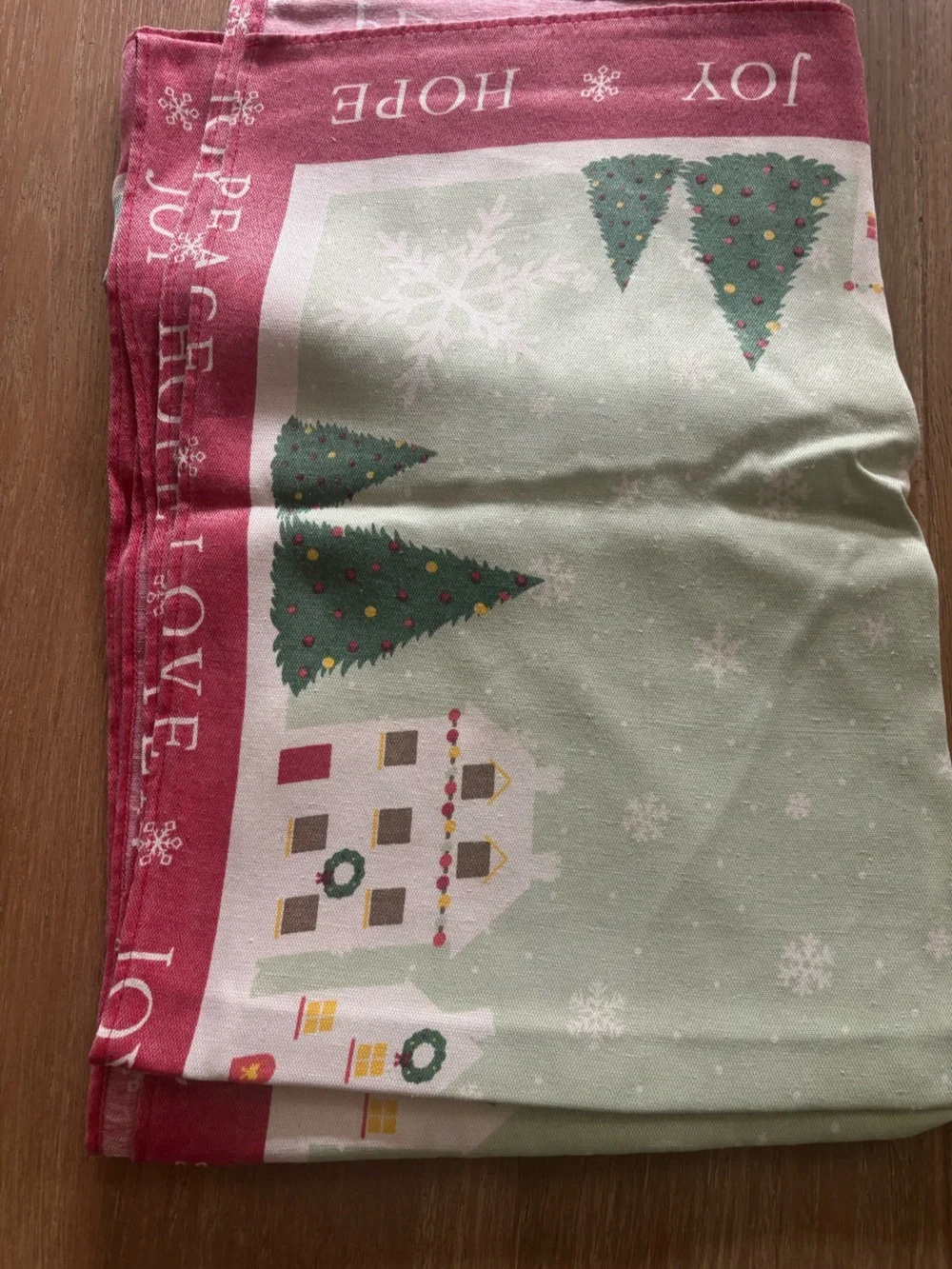 St. Nicholas Square Holiday Village Table cloth in Red, Green, White